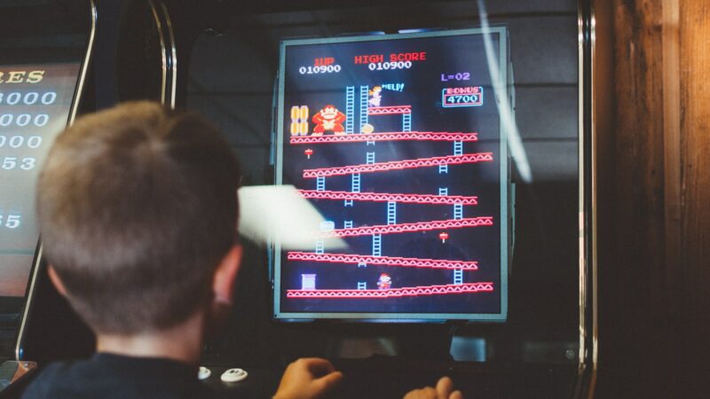 boy playing donkey kong arcade box